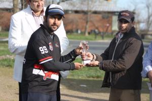 Challengers Captain collects the winners replica trophy