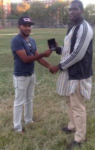 velloCricket/EACA Trivia Winner, USA U-19 19 Batsman Trevis Ross receives his Token from Dyon Ravello