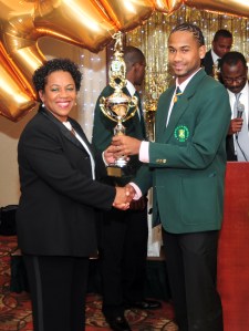 MVP Alex Amsterdam (right) accepts one of his many accolades from fellow Atlantis player Joan Alexander-Serrano