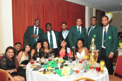 Some of the Atlantis players with a bevy of young beauties