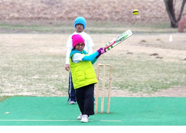 Young Female Cricketer plays a Pull shot