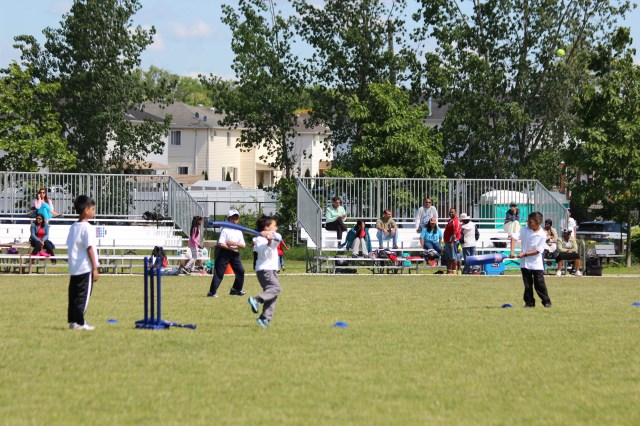 Cricket Let's Play USA cricketers play modified game as Parents look on, Photo by Mark Audain