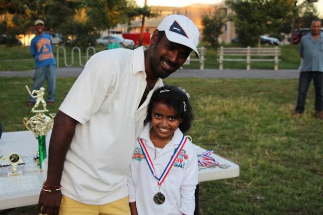CLPUSA Parent presented a medal to a Female Pee-Wee Cricketer