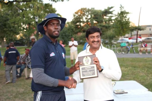 CLPUSA Coach Ravello presented CricMax Coach Ashok Patel with a momento