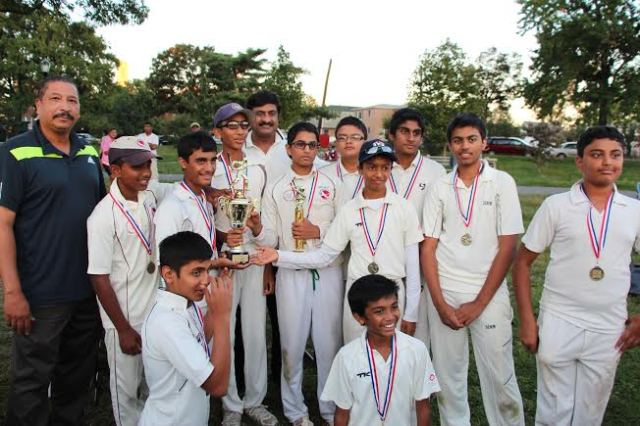 Team Cricmax showing of their medals and trophies presented by the VelloCricket Journal